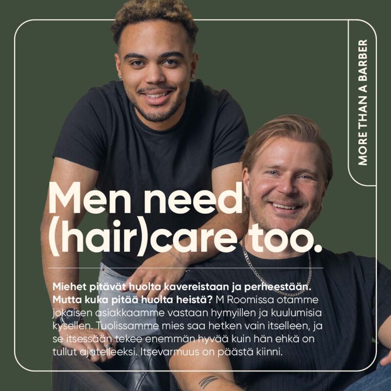 Kaksi hymyilevää miestä mainoskuvassa; keskellä teksti “Men need (hair)care too.” ja reunassa pystysuunnassa “MORE THAN A BARBER”, alhaalla suomenkielinen teksti miesten hiusten- ja parranhoidosta.